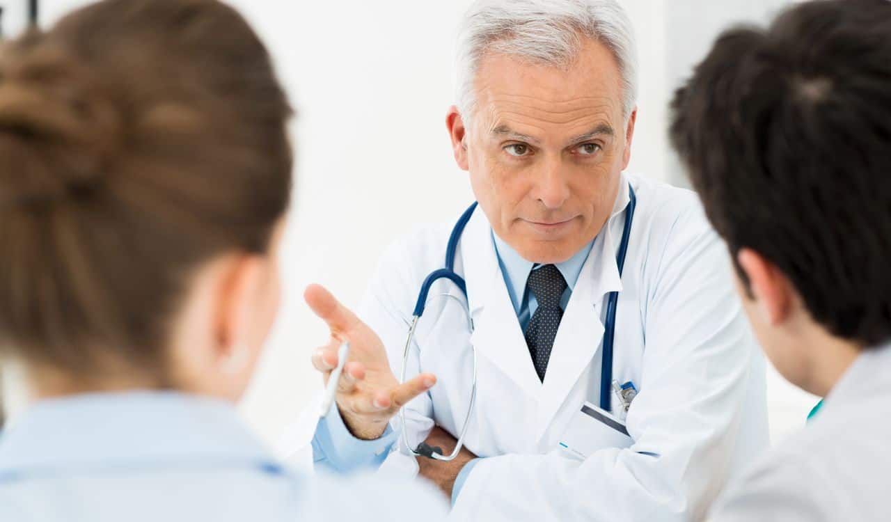 Doctor Discussing With Patients