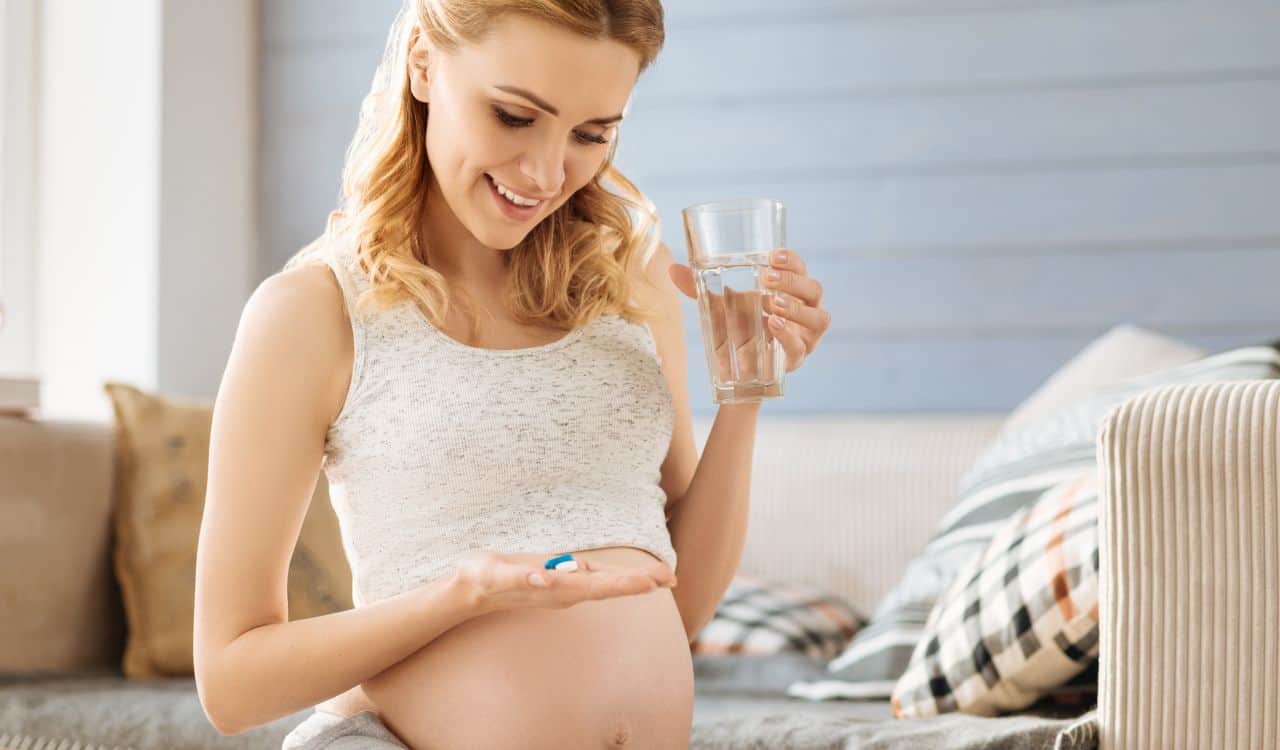 Pregnant Woman Taking Pills