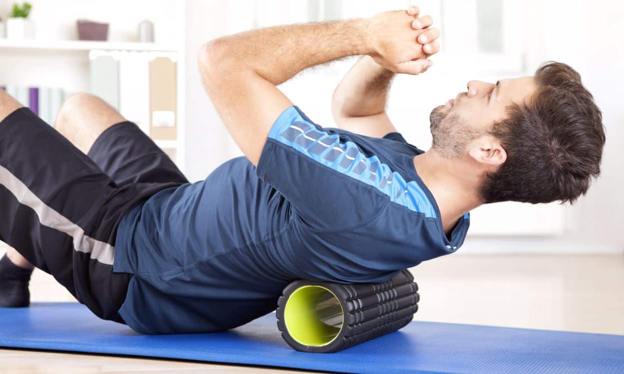 Man Uses Foam Roller For Back Pain Relief