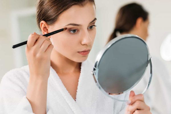 Woman Holding The Makeup Mirror