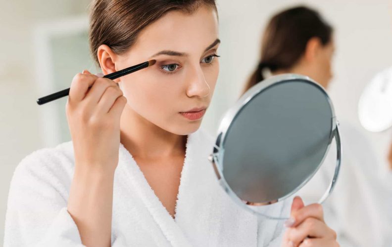 Woman Holding The Makeup Mirror