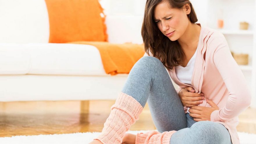 5 Foods to Avoid When Your Tummy Hurts woman experiencing tummy hurts