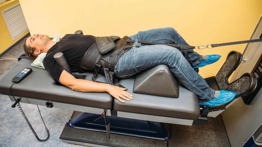 Does Traction Help Lower Back Pain? Man Treats Back Pain Using Traction