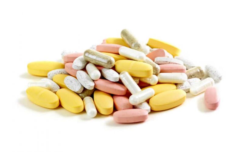Vitamin pills and capsules