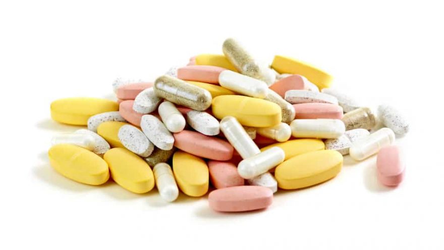 Vitamin pills and capsules