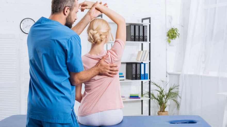 Therapist Treats Patient With Back Pain